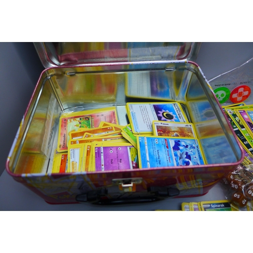 853 - Over 300 Pokemon cards with Celebrations collectors tin including holos and vintage cards