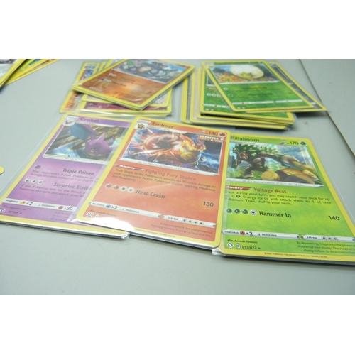 860 - Thirty holo/reverse holo and 300 common/uncommon/rare Pokemon cards in tin