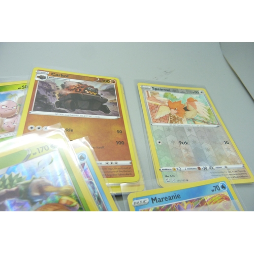 861 - Thirty holo/reverse holo and 300 common/uncommon/rare Pokemon cards in tin