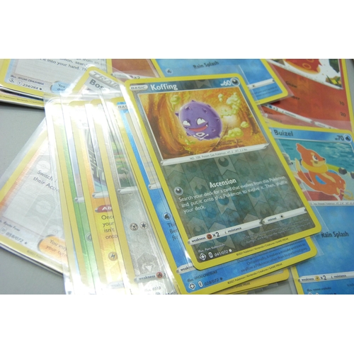 864 - Thirty holo/reverse holo and 300 common/uncommon/rare Pokemon cards in tin