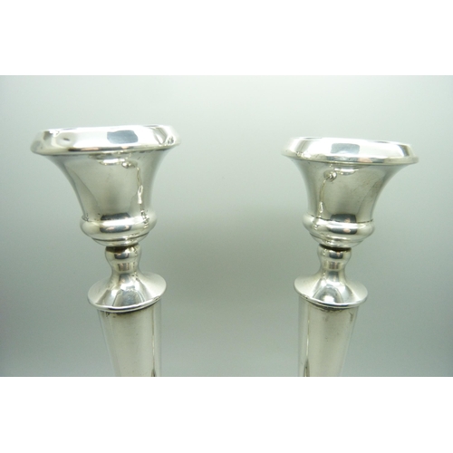 871 - A pair of silver weighted candlesticks, one a/f, 20.5cm