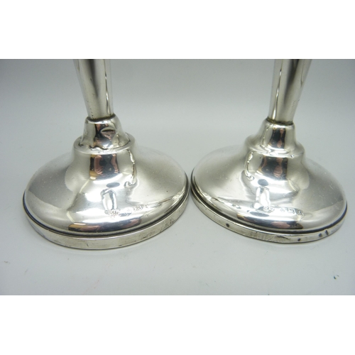 871 - A pair of silver weighted candlesticks, one a/f, 20.5cm