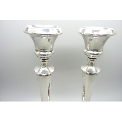 871 - A pair of silver weighted candlesticks, one a/f, 20.5cm