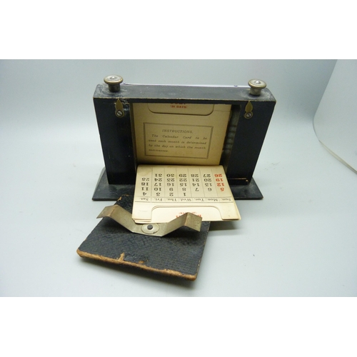 872 - A silver fronted perpetual desk calendar