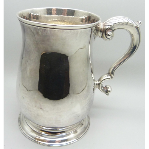 873 - A George II silver baluster mug, London 1754, Fuller White, 380g