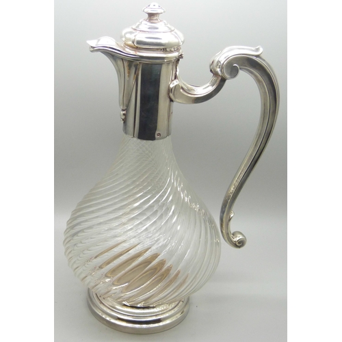 879 - A barleytwist glass claret jug with white metal top and base