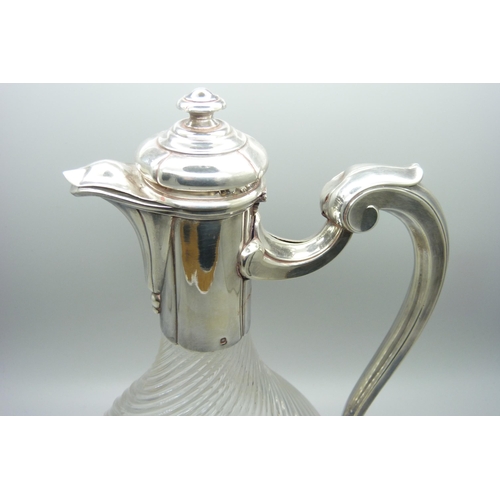 879 - A barleytwist glass claret jug with white metal top and base