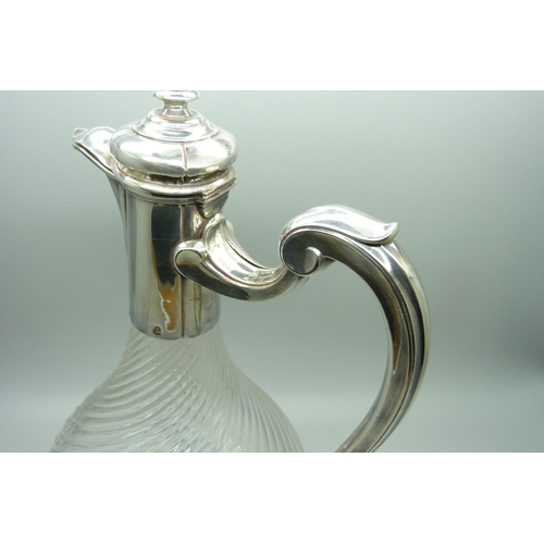 879 - A barleytwist glass claret jug with white metal top and base