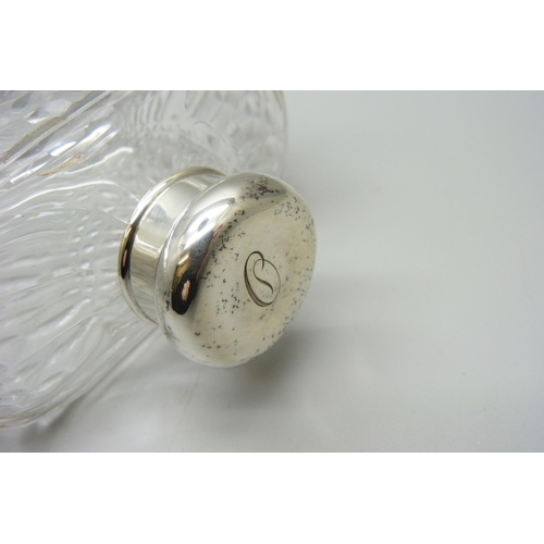 882 - A silver topped glass flask