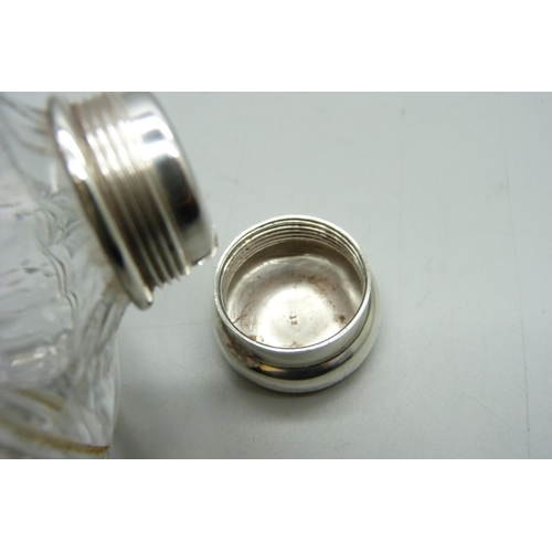 882 - A silver topped glass flask