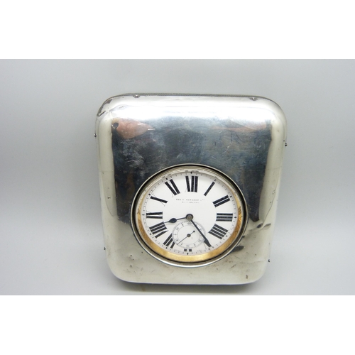 898 - A silver fronted watch stand with a Goliath pocket watch