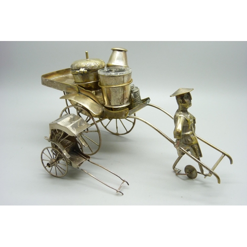 914 - A white metal cruet in the form of a rickshaw and a small Chinese silver model carriage