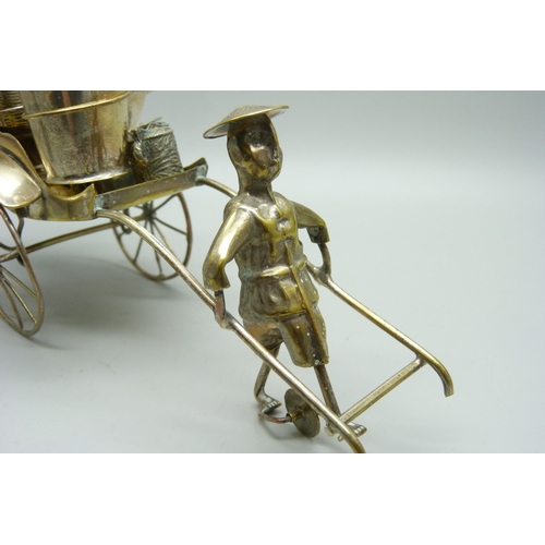 914 - A white metal cruet in the form of a rickshaw and a small Chinese silver model carriage