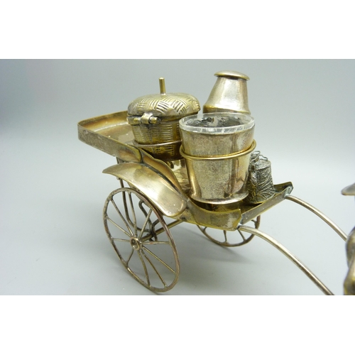 914 - A white metal cruet in the form of a rickshaw and a small Chinese silver model carriage