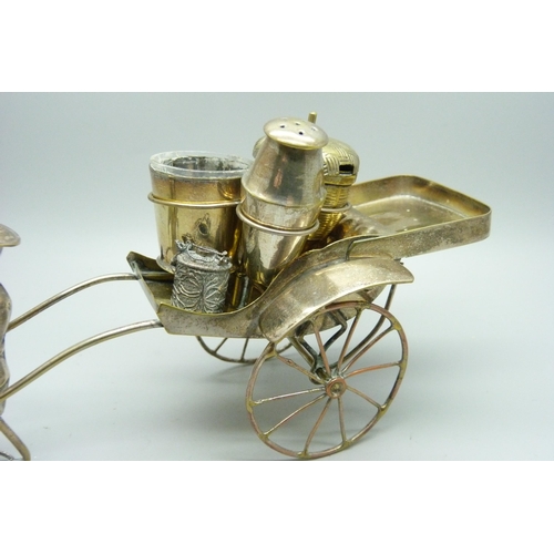 914 - A white metal cruet in the form of a rickshaw and a small Chinese silver model carriage