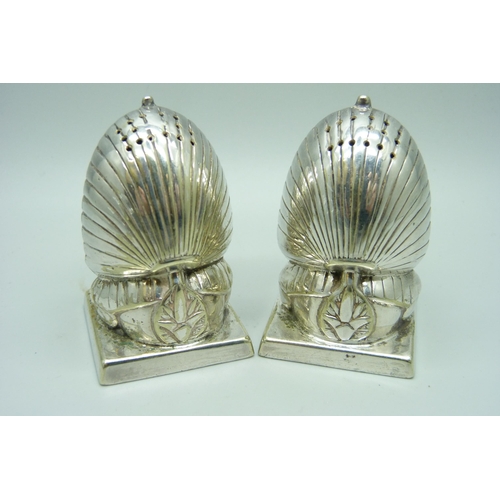 924 - A pair of Mappin & Webb Egyptian Revival silver plated salt and pepper pots