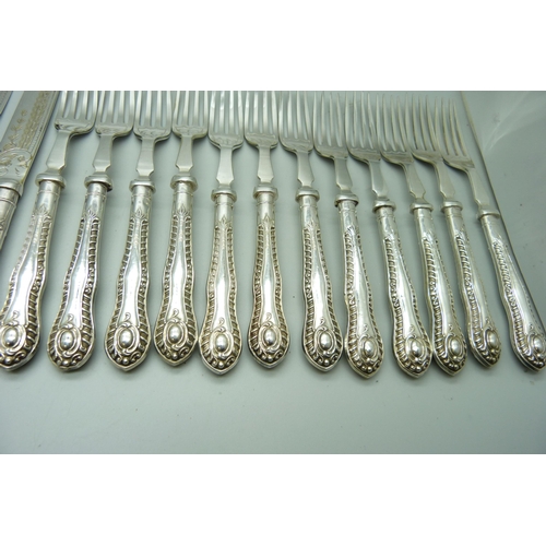 934 - Twenty-four silver handled fruit knives and forks