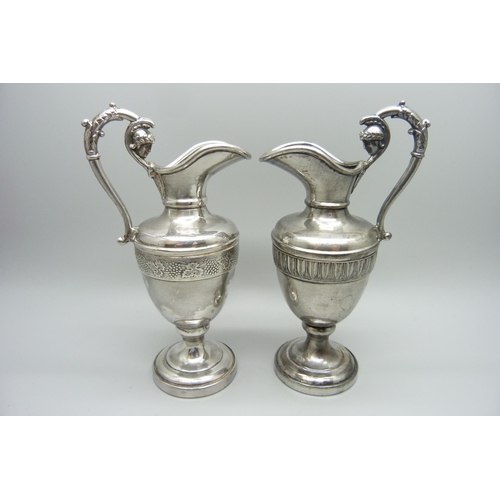 939 - Two small silver plated ewers