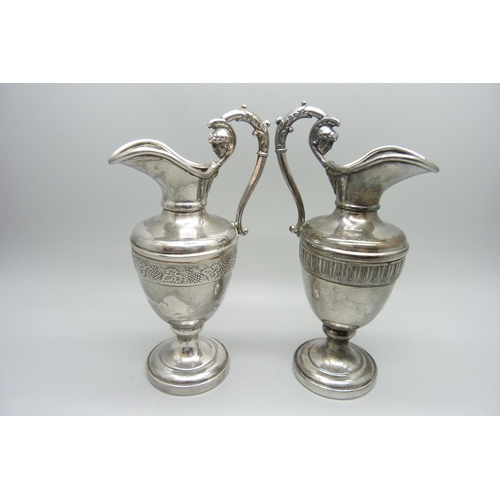 939 - Two small silver plated ewers