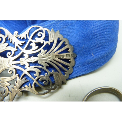 941 - A silver nurse's belt buckle with silver nursing badge, scissors, a thermometer in metal tube and tw... 