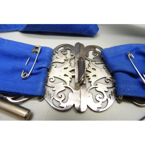 941 - A silver nurse's belt buckle with silver nursing badge, scissors, a thermometer in metal tube and tw... 