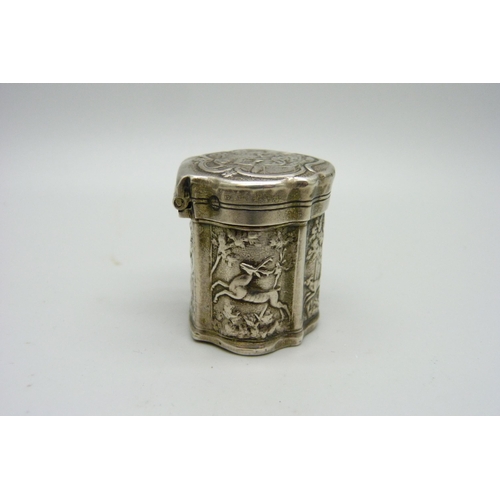 947 - A continental silver embossed box decorated with hunting scenes, 37mm