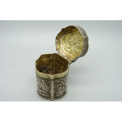 947 - A continental silver embossed box decorated with hunting scenes, 37mm