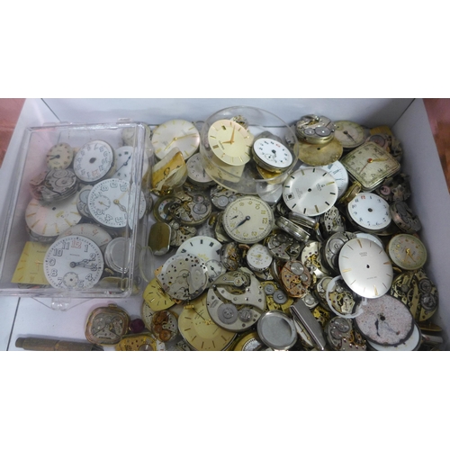 975 - A box of wristwatch movements, Record, Gruen, Waltham, Seiko and trench watch movements