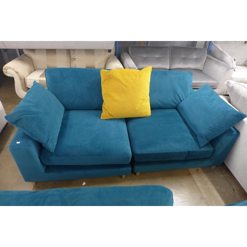 1343 - An Audrey teal velvet three seater sofa and footstool