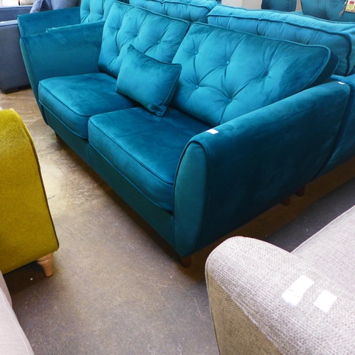 1376 - A teal velvet button back three seater sofa