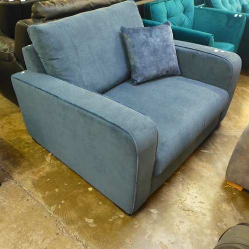 1429 - A steel blue corduroy loveseat - damage to back