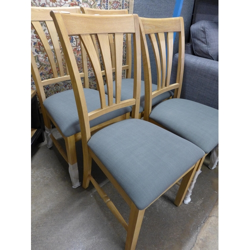 1435 - A set of four oak and dark grey upholstered dining chairs