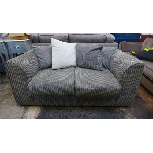 1460 - A grey jumbo corduroy two seater sofa