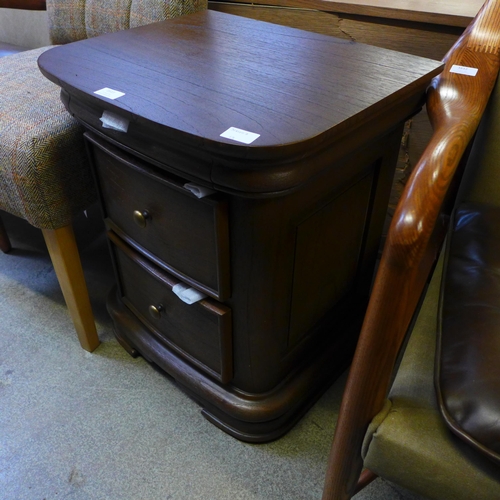 1572 - A Liberty, three drawer bedside chest in dark oak