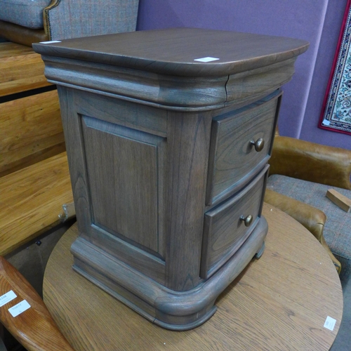 1586 - A Liberty, three drawer, bedside chest in stained oak