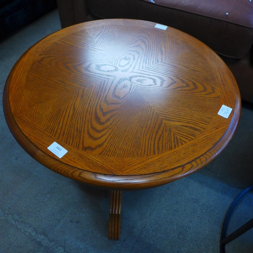 1589 - A circular wooden engraved lamp table