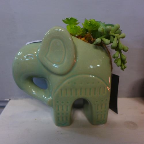 1307 - A faux succulent plant in a green ceramic elephant pot- H 17cms  (67689704 )