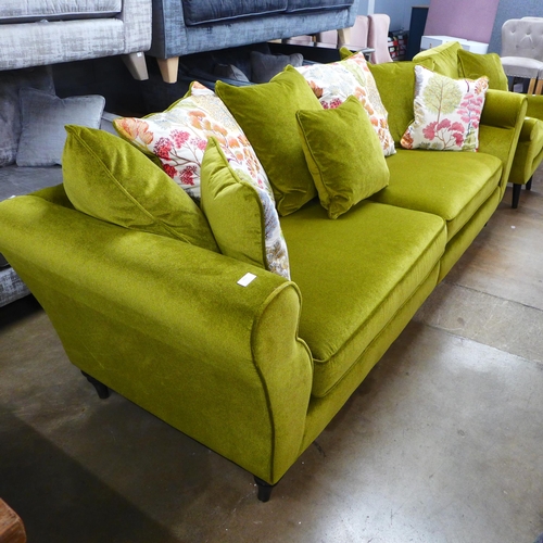 1456 - A metallic sheen green upholstered four seater sofa with patterned scatter cushions