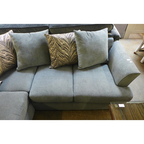 1504 - A stone upholstered corner sofa