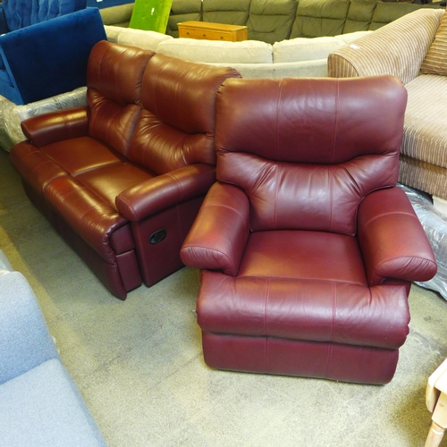 1634 - A chestnut leather two seater reclining sofa and reclining armchair