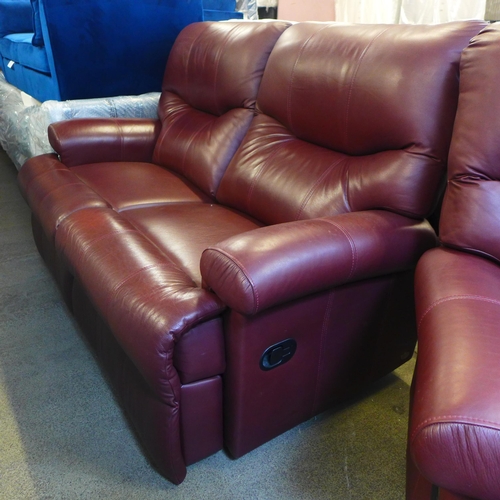 1634 - A chestnut leather two seater reclining sofa and reclining armchair