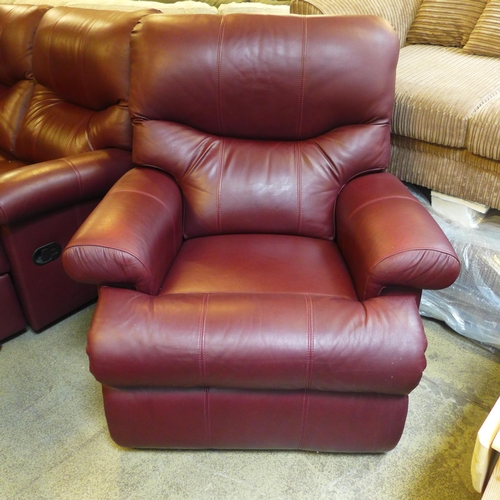 1634 - A chestnut leather two seater reclining sofa and reclining armchair