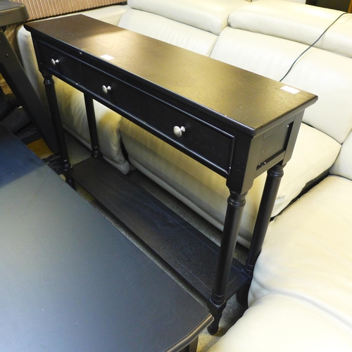 1642 - A black three drawer console table, damaged