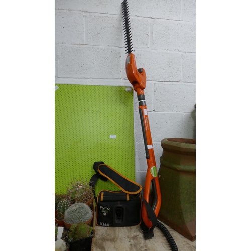 2441 - Flymo cordless extending hedge trimmer with battery