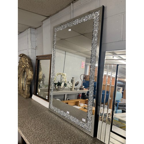 1518 - A Gatsby mirror with bevelled edges and border with crushed glass crystals, H 120 x 80cms 9G80X12059... 