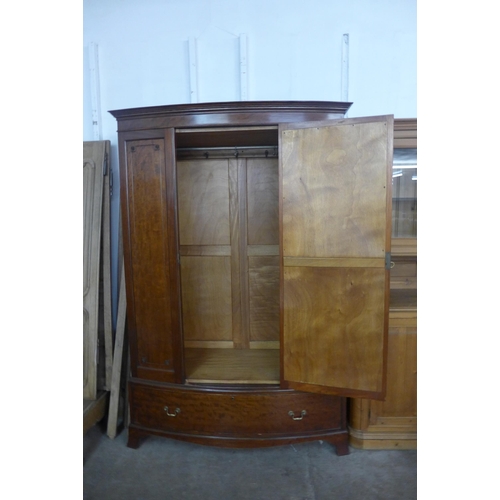 224 - An Edward VII mahogany bow front wardrobe