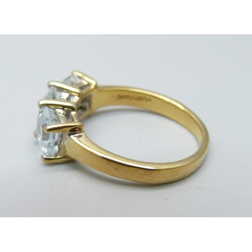 1030 - A silver gilt and three stone ring, N