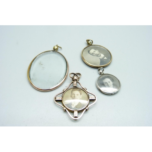 1036 - A 9ct gold oval picture locket, a hallmarked silver picture locket and two plated picture lockets