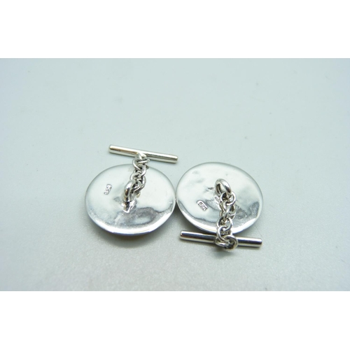 1041 - A pair of silver and enamel horse cufflinks