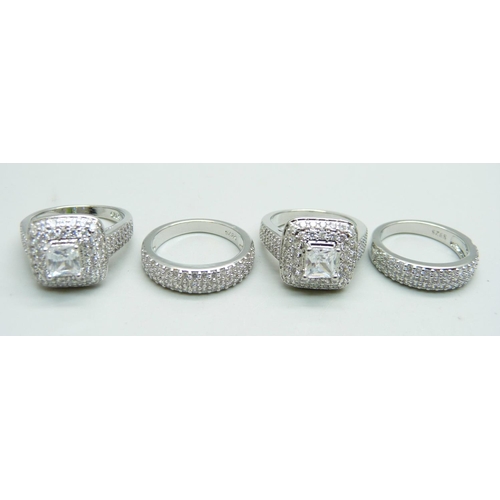 1042 - Four silver dress rings, marked S925, unused, 3x L and N